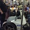 Cop Brings NYPD Scooter On Rush Hour Subway Train